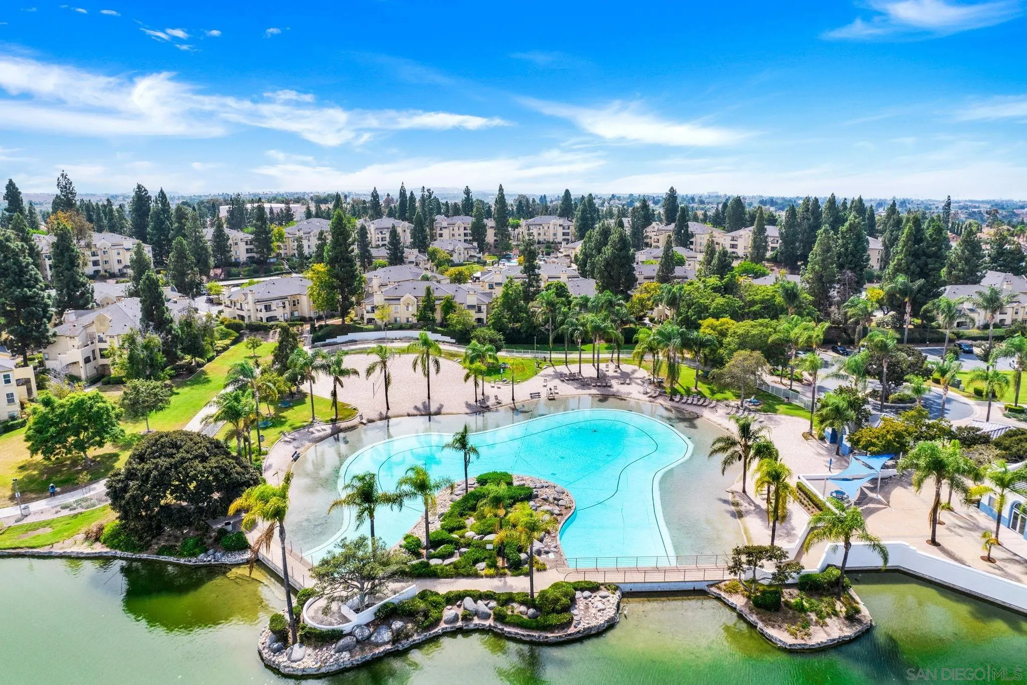 767 Brookstone Road, Unit 201 Chula Vista, CA 91913 - Photo 56 of 56 a view of a swimming pool with potted plants and large trees