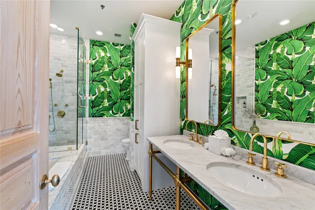 a bedroom with bed and a flat tv screen