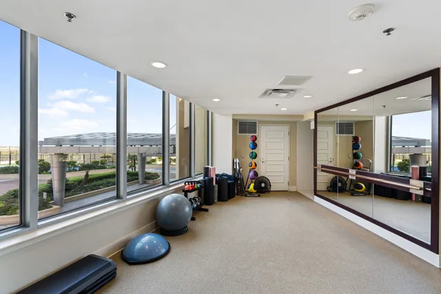 a lobby with furniture and floor to ceiling window