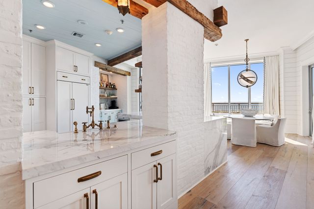 a bathroom with a granite countertop sink mirror and vanity