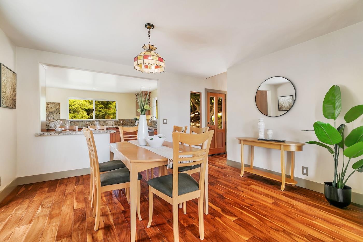 411 Hecker Pass Road Watsonville, CA 95076 - Photo 14 of 76 a view of a dining room with furniture window and wooden floor
