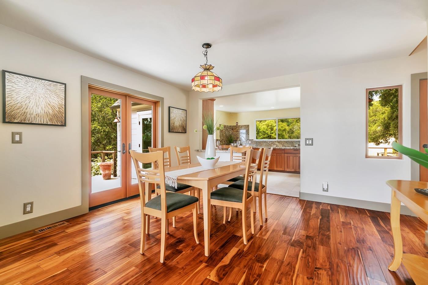 411 Hecker Pass Road Watsonville, CA 95076 - Photo 15 of 76 a view of a dining room with furniture window and wooden floor