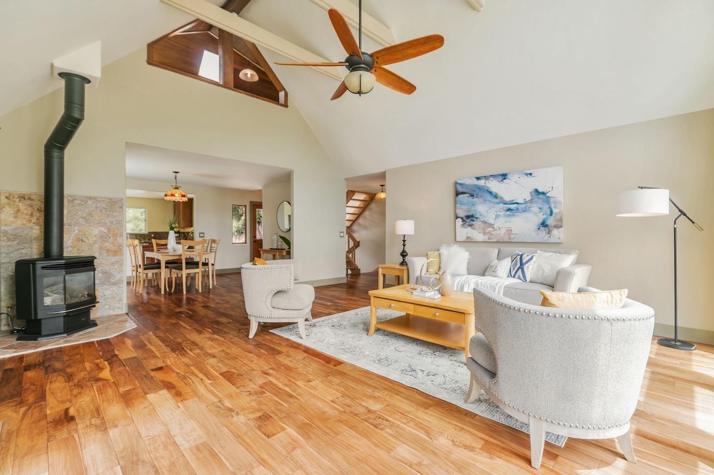 411 Hecker Pass Road Watsonville, CA 95076 - Photo 16 of 76 a living room with furniture and a flat screen tv