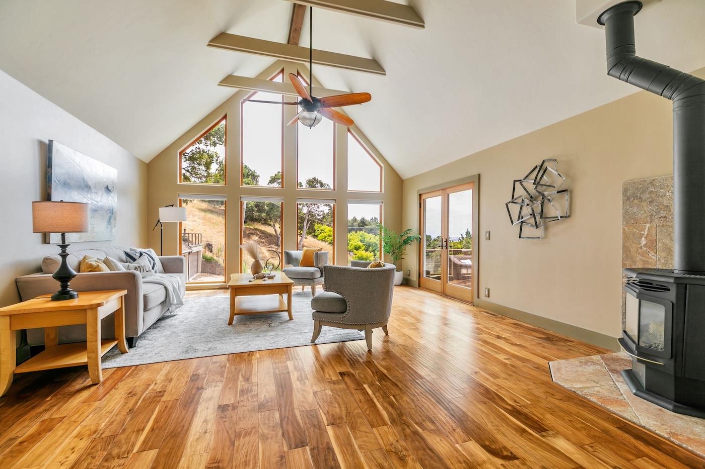 411 Hecker Pass Road Watsonville, CA 95076 - Photo 18 of 76 a living room with furniture and a wooden floor