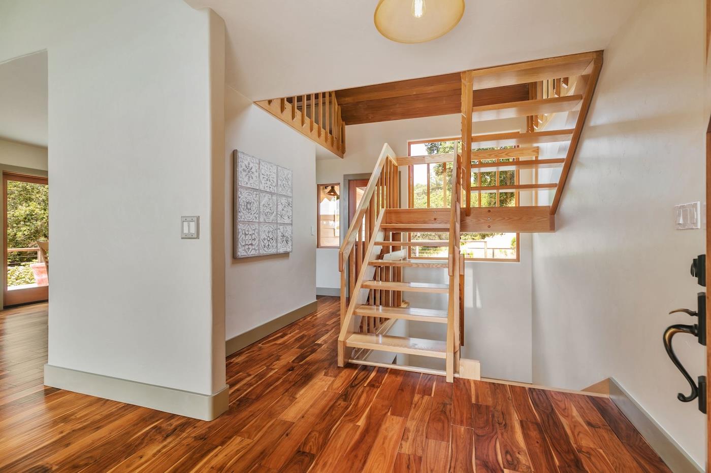 411 Hecker Pass Road Watsonville, CA 95076 - Photo 19 of 76 a view of empty room with wooden floor and fan