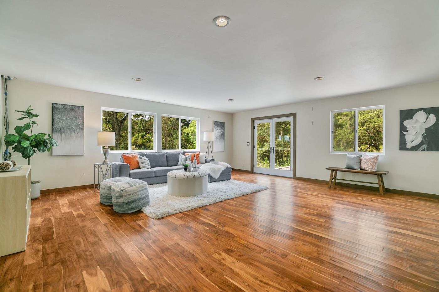 411 Hecker Pass Road Watsonville, CA 95076 - Photo 20 of 76 a living room with fireplace furniture and a wooden floor