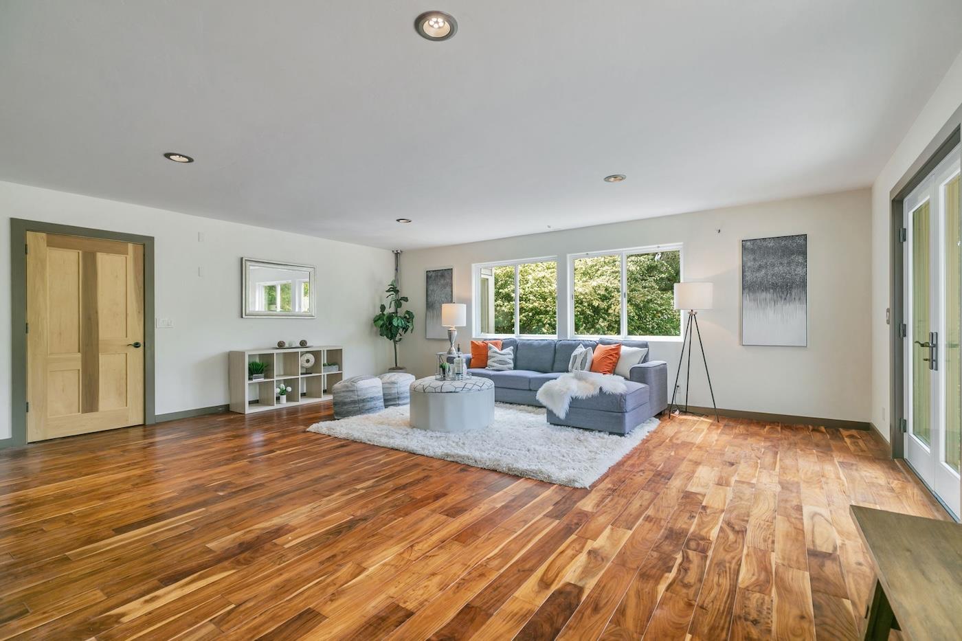 411 Hecker Pass Road Watsonville, CA 95076 - Photo 21 of 76 a living room with furniture and a wooden floor