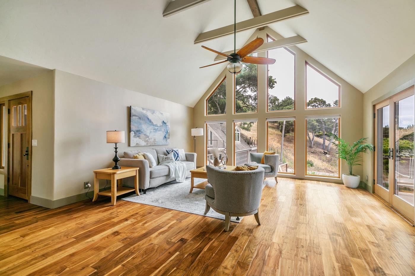 411 Hecker Pass Road Watsonville, CA 95076 - Photo 3 of 76 a living room with furniture and a wooden floor