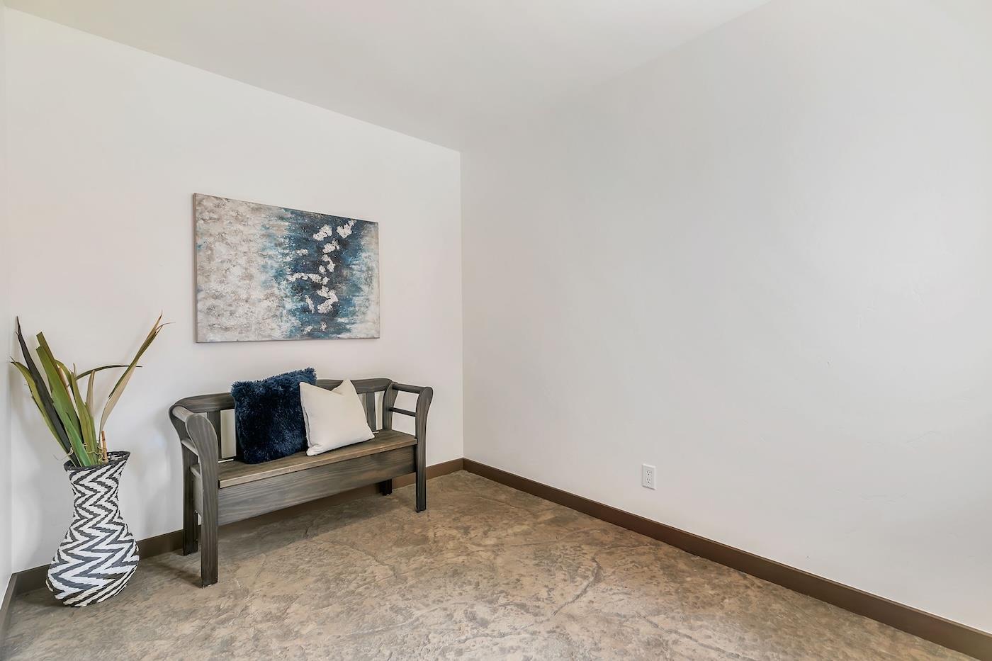 411 Hecker Pass Road Watsonville, CA 95076 - Photo 33 of 76 a white couch sitting in a room next to a blue wall