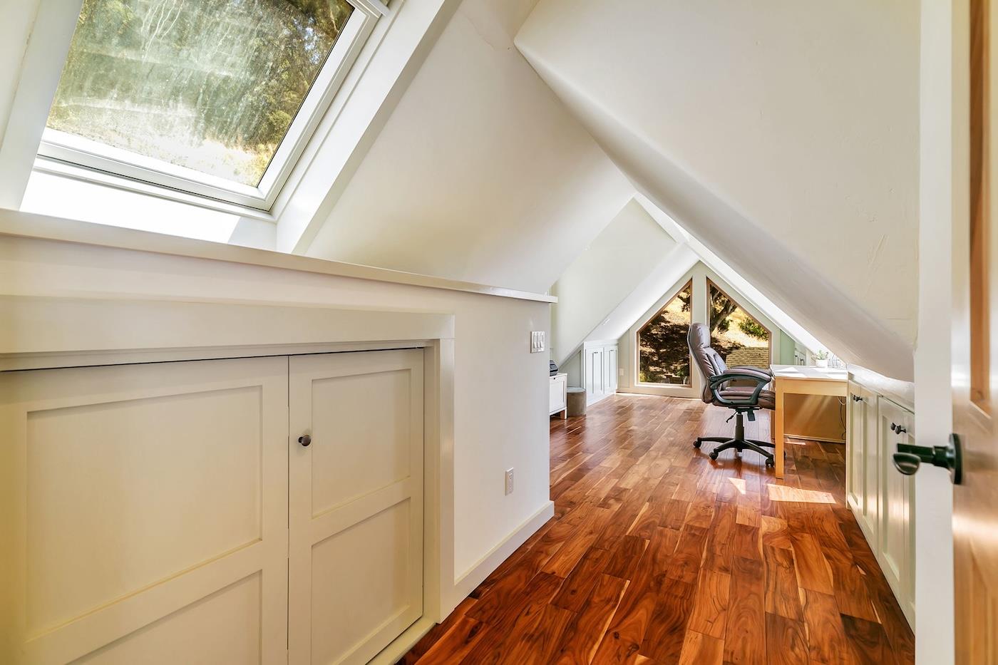411 Hecker Pass Road Watsonville, CA 95076 - Photo 35 of 76 a view of a house with wooden floor and furniture