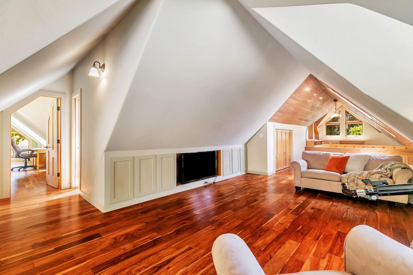 411 Hecker Pass Road Watsonville, CA 95076 - Photo 39 of 76 a view of livingroom and dining room with wooden floor
