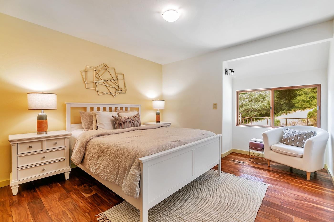 411 Hecker Pass Road Watsonville, CA 95076 - Photo 42 of 76 a bedroom with a bed and a couch