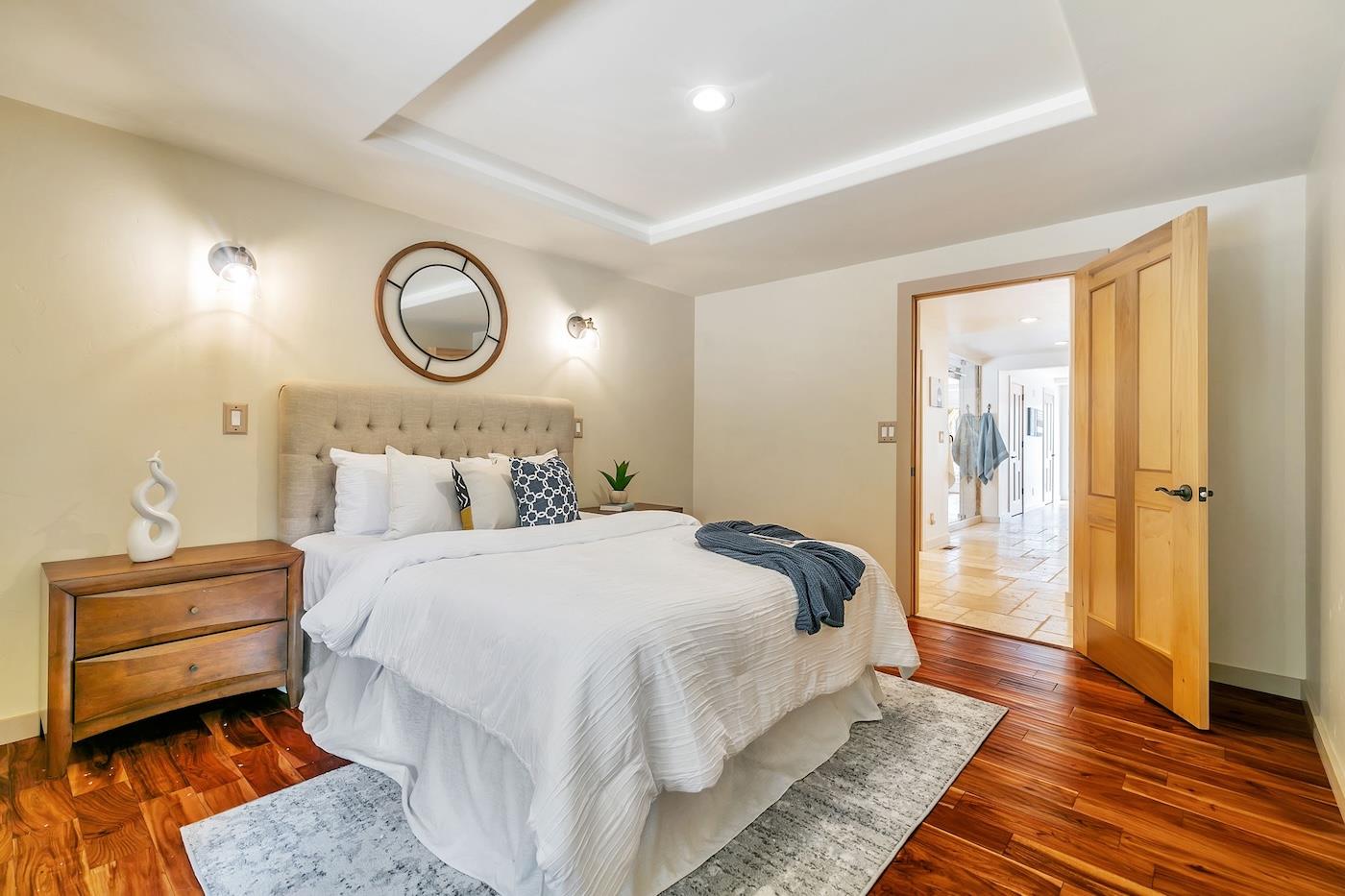 411 Hecker Pass Road Watsonville, CA 95076 - Photo 45 of 76 a bedroom with bed and wooden floor