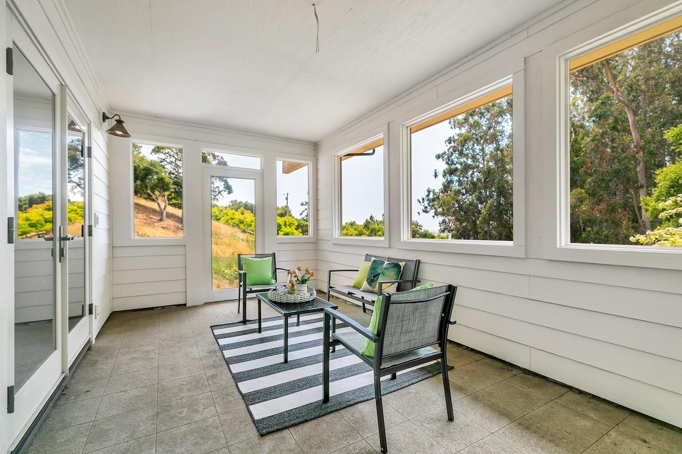 411 Hecker Pass Road Watsonville, CA 95076 - Photo 58 of 76 a living room with furniture and a large window
