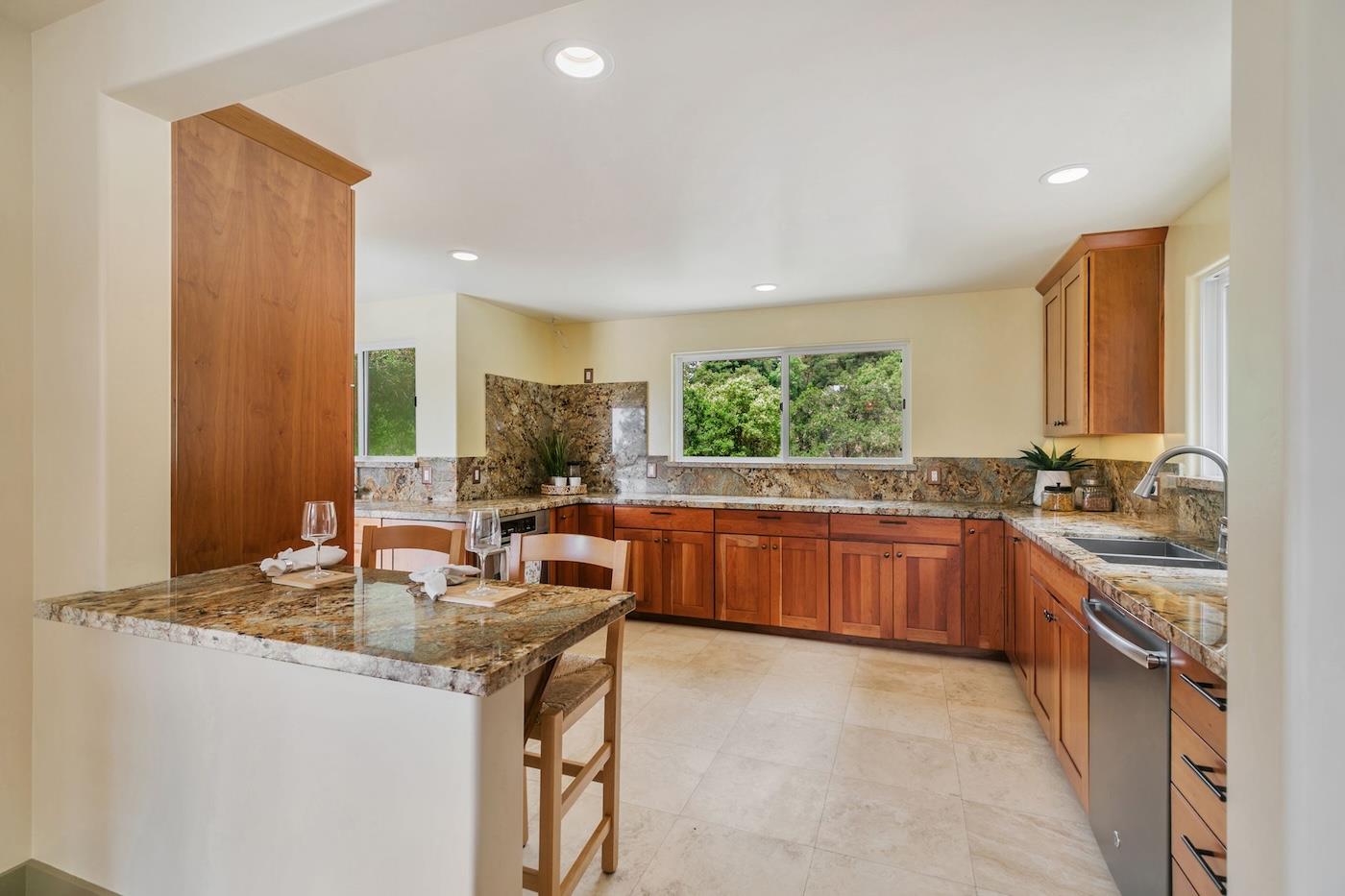 411 Hecker Pass Road Watsonville, CA 95076 - Photo 6 of 76 a kitchen with stainless steel appliances granite countertop a sink stove and cabinets