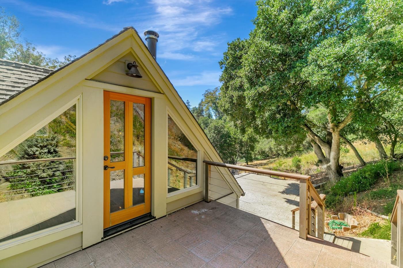 411 Hecker Pass Road Watsonville, CA 95076 - Photo 63 of 76 a front view of a house with garden