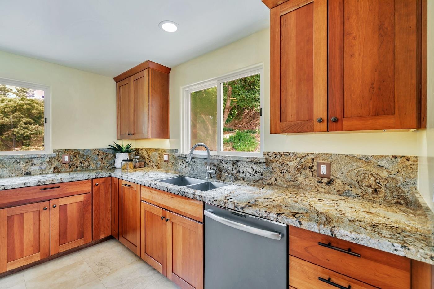 411 Hecker Pass Road Watsonville, CA 95076 - Photo 9 of 76 a kitchen with a sink stove and cabinets