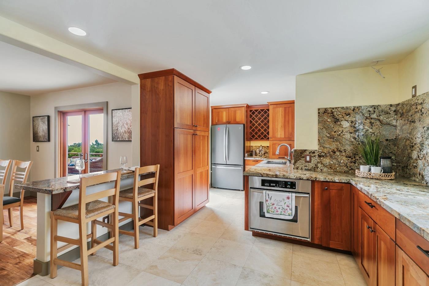 411 Hecker Pass Road Watsonville, CA 95076 - Photo 10 of 76 a kitchen with stainless steel appliances granite countertop a stove and a refrigerator