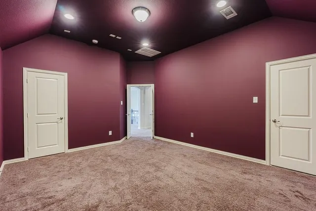 a view of a hallway with windows and entryway