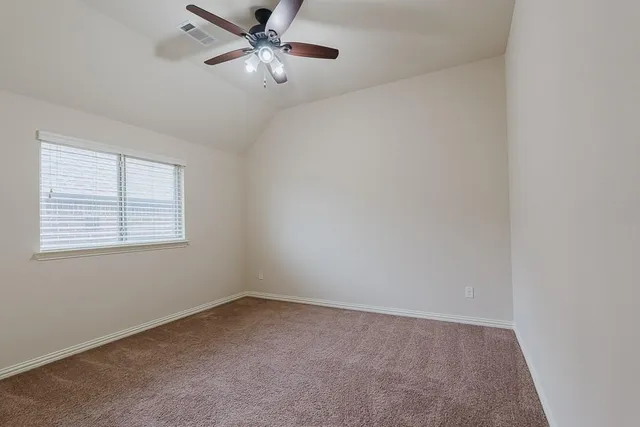 an empty room with a bathroom