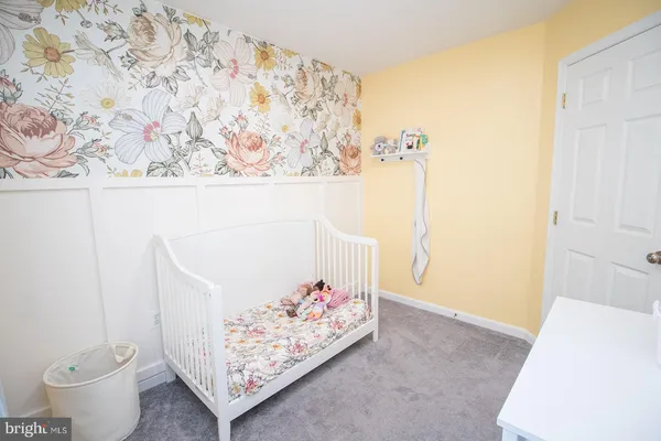 a view of a hallway with paintings on the wall