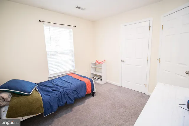 a room with gym equipment and a table