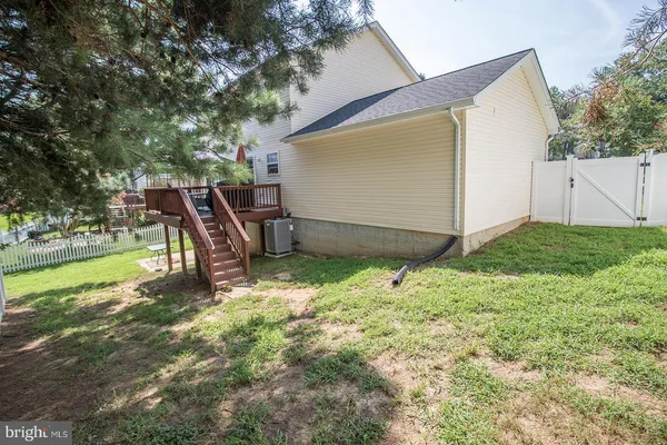 a view of a backyard with plants and a patio