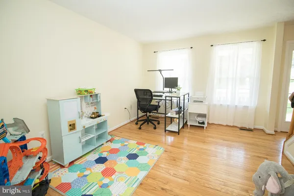 a kitchen with stainless steel appliances granite countertop a stove top oven a sink and a refrigerator