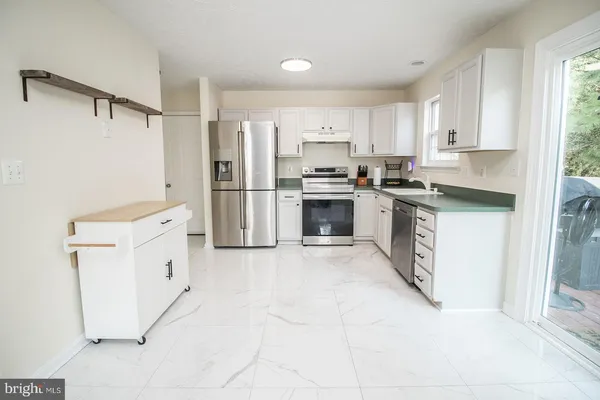 a bathroom with a sink mirror vanity and toilet