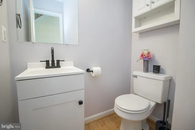 a view of a yard with wooden fence