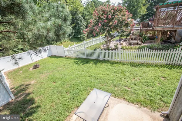 a front view of a house with a yard and porch