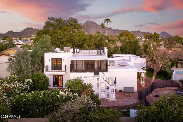 an aerial view of a house with a garden