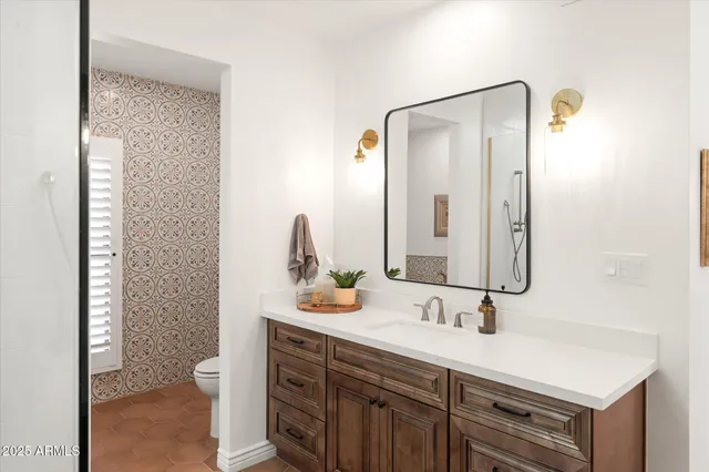 a bedroom with furniture and a window