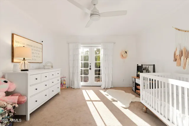 a bedroom with furniture and a flat screen tv