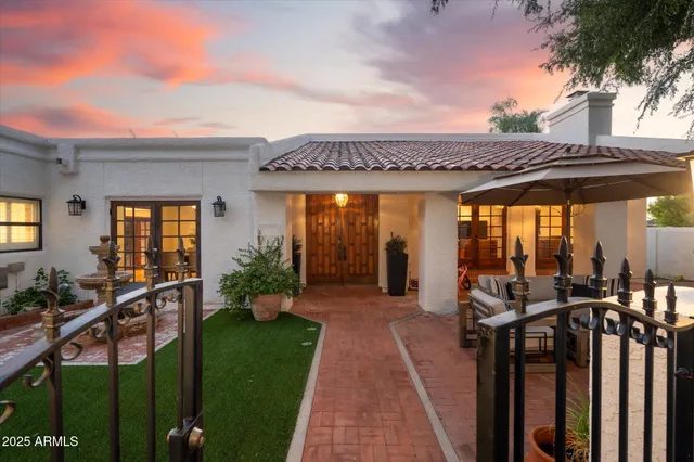a view of a patio with furniture and a yard