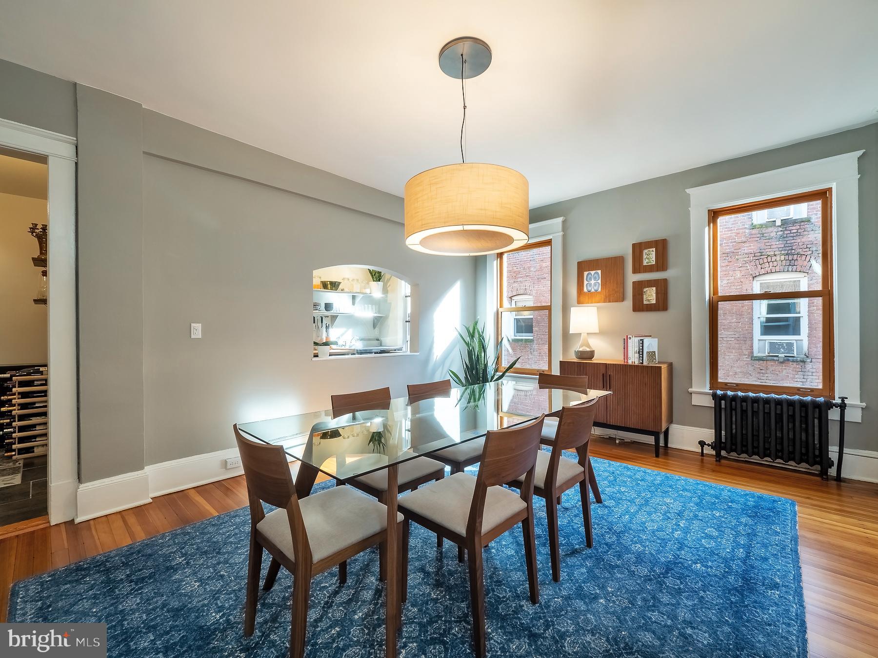 1736 Columbia Road Northwest, Unit 309 Washington, DC 20009 - Photo 11 of 38 a view of a dining room with furniture window and wooden floor