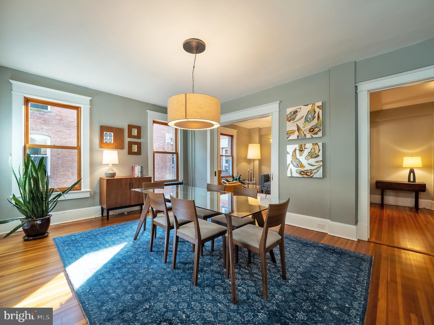1736 Columbia Road Northwest, Unit 309 Washington, DC 20009 - Photo 12 of 38 a view of a dining room with furniture window and wooden floor