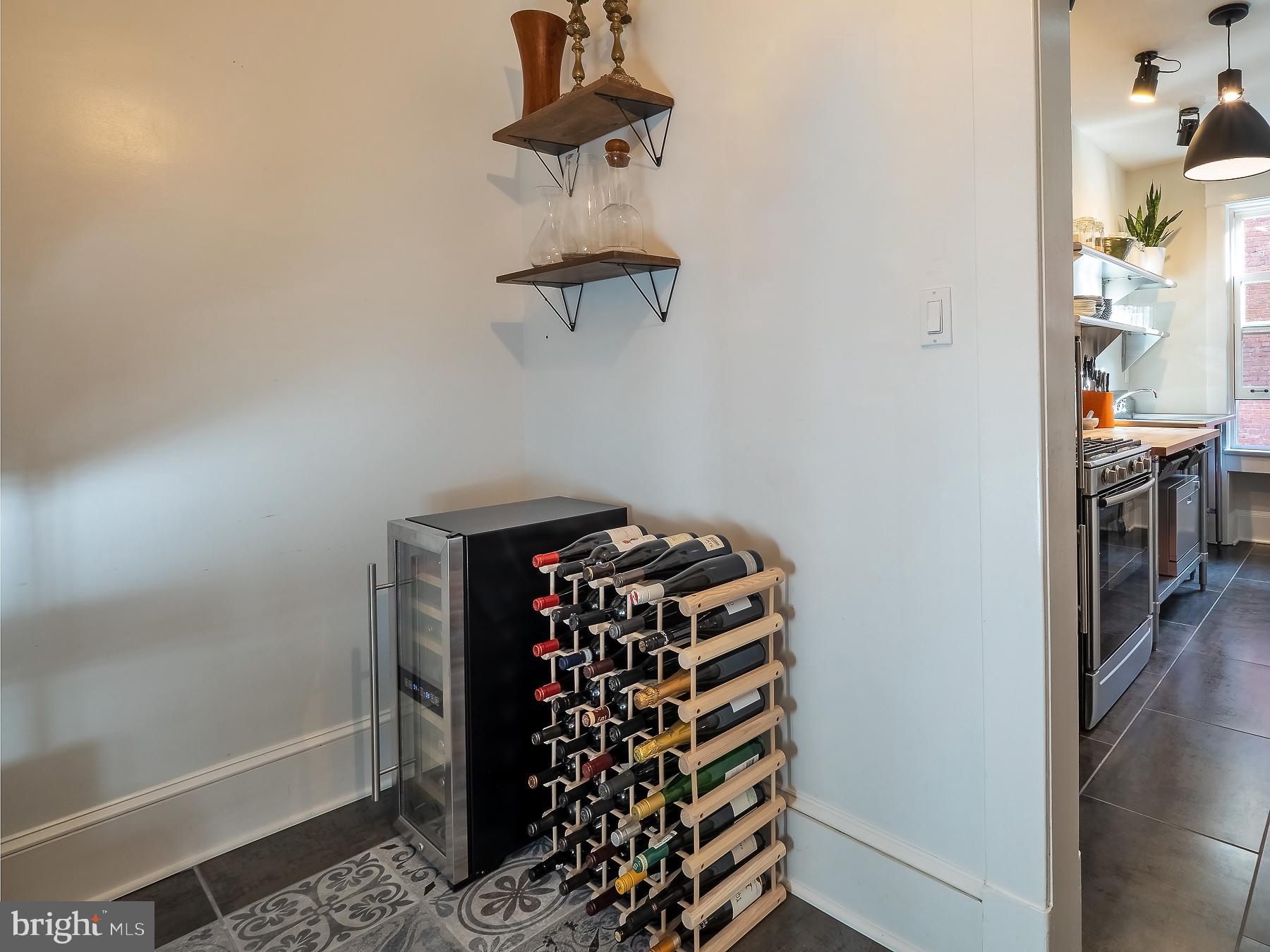 1736 Columbia Road Northwest, Unit 309 Washington, DC 20009 - Photo 14 of 38 a view of a hallway with rack on the wall