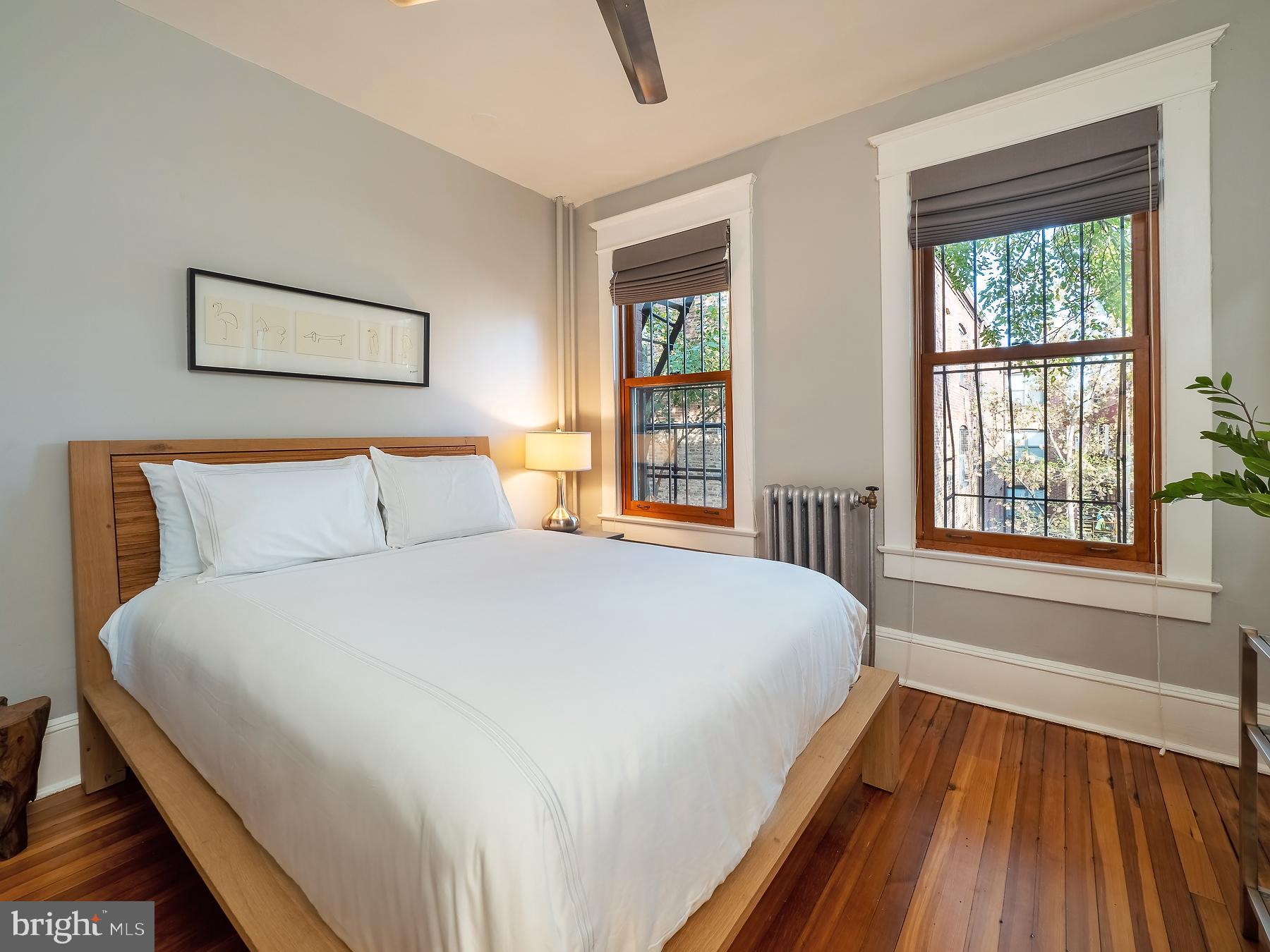 1736 Columbia Road Northwest, Unit 309 Washington, DC 20009 - Photo 18 of 38 a bedroom with bed and window