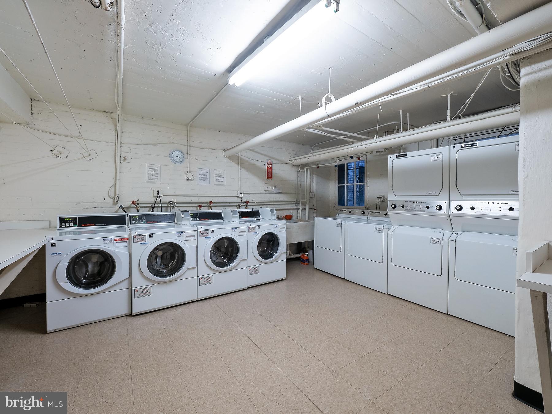 1736 Columbia Road Northwest, Unit 309 Washington, DC 20009 - Photo 29 of 38 a utility room with dryer and washer
