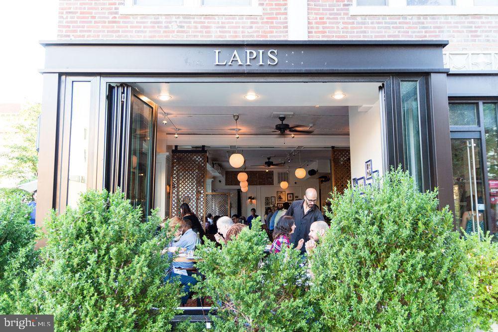 1736 Columbia Road Northwest, Unit 309 Washington, DC 20009 - Photo 34 of 38 a front view of a house with plants