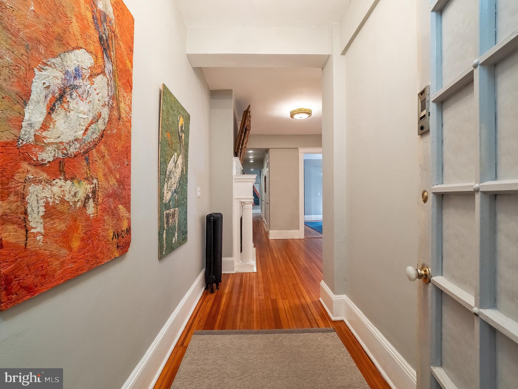 1736 Columbia Road Northwest, Unit 309 Washington, DC 20009 - Photo 4 of 38 a very nice looking room with wooden floor