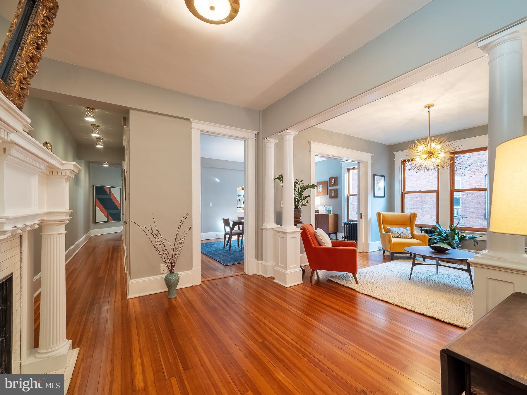 1736 Columbia Road Northwest, Unit 309 Washington, DC 20009 - Photo 5 of 38 a living room with furniture and wooden floor