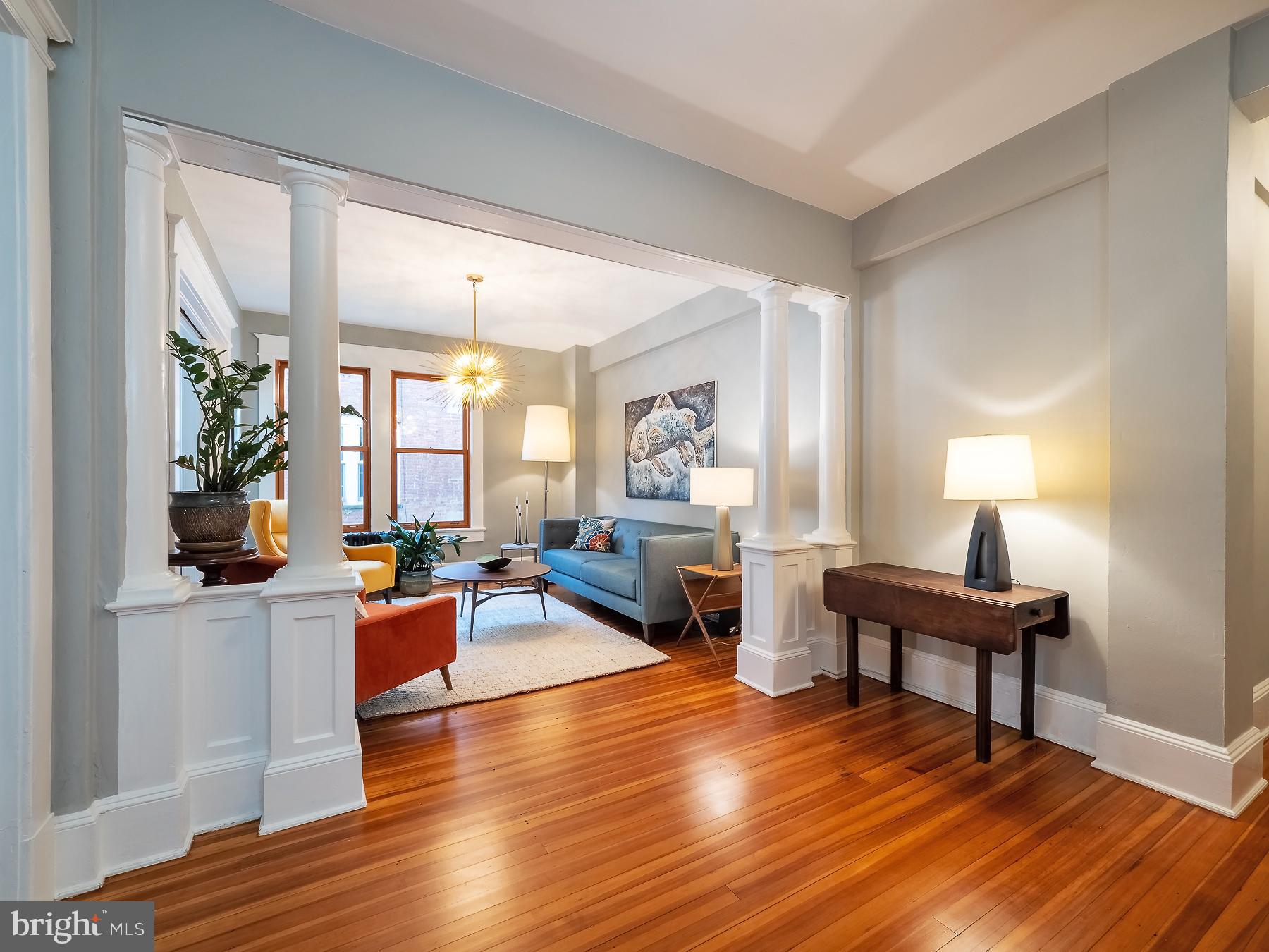 1736 Columbia Road Northwest, Unit 309 Washington, DC 20009 - Photo 6 of 38 a living room with furniture and a wooden floor