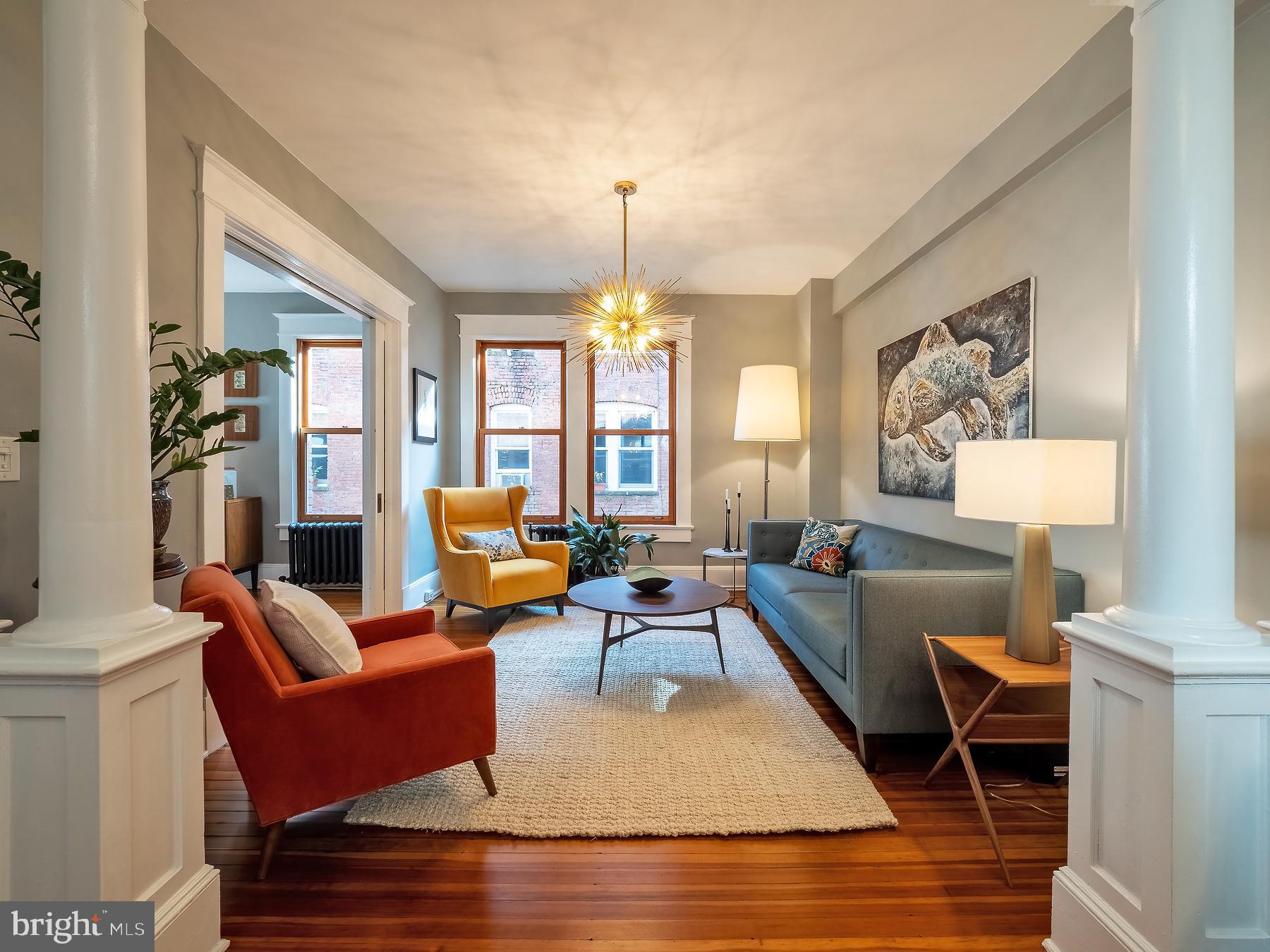 1736 Columbia Road Northwest, Unit 309 Washington, DC 20009 - Photo 7 of 38 a living room with furniture fireplace and a window