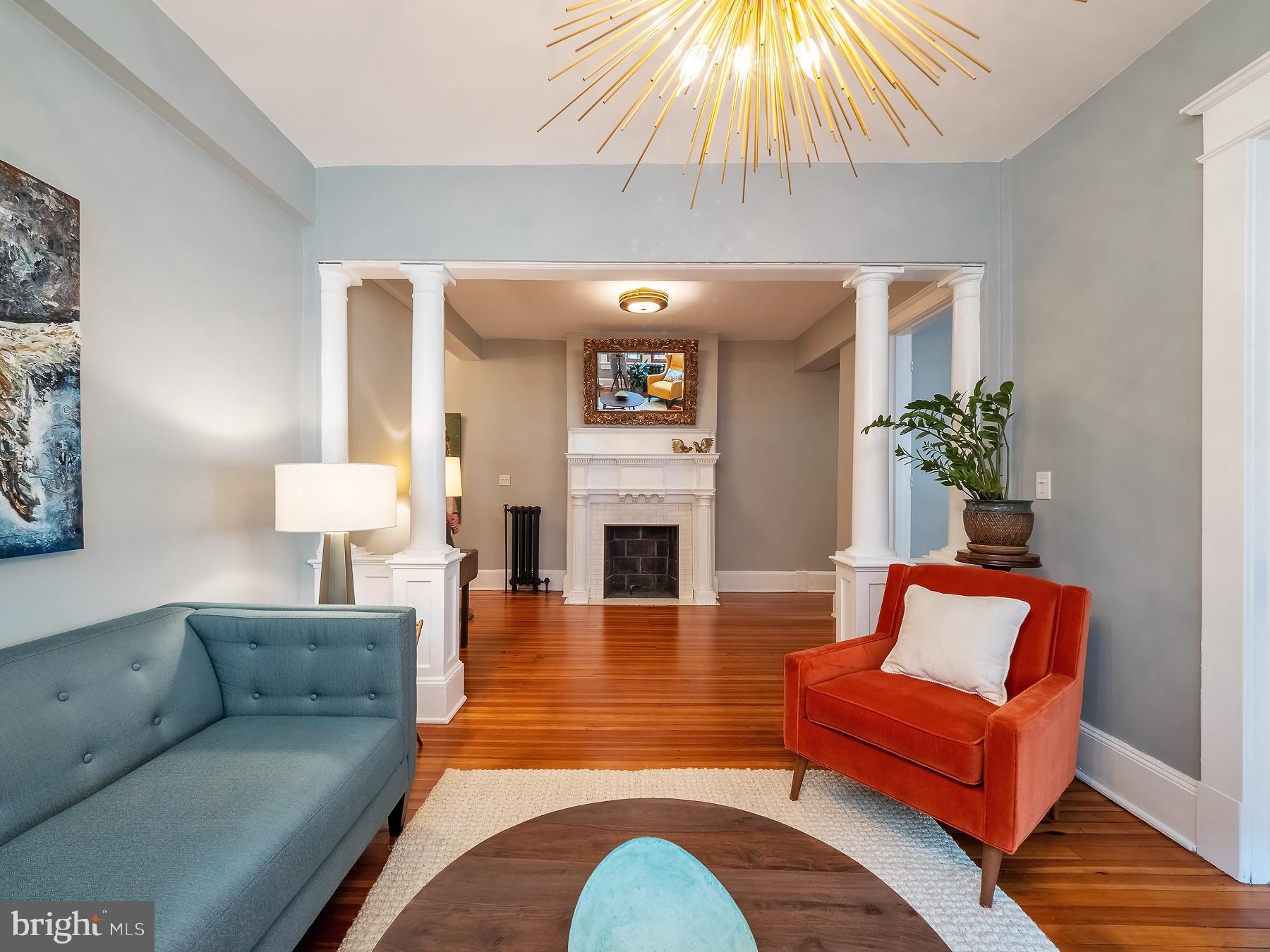 1736 Columbia Road Northwest, Unit 309 Washington, DC 20009 - Photo 9 of 38 a living room with furniture and a fireplace