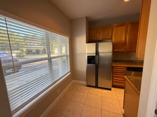 a view of a kitchen with a refrigerator