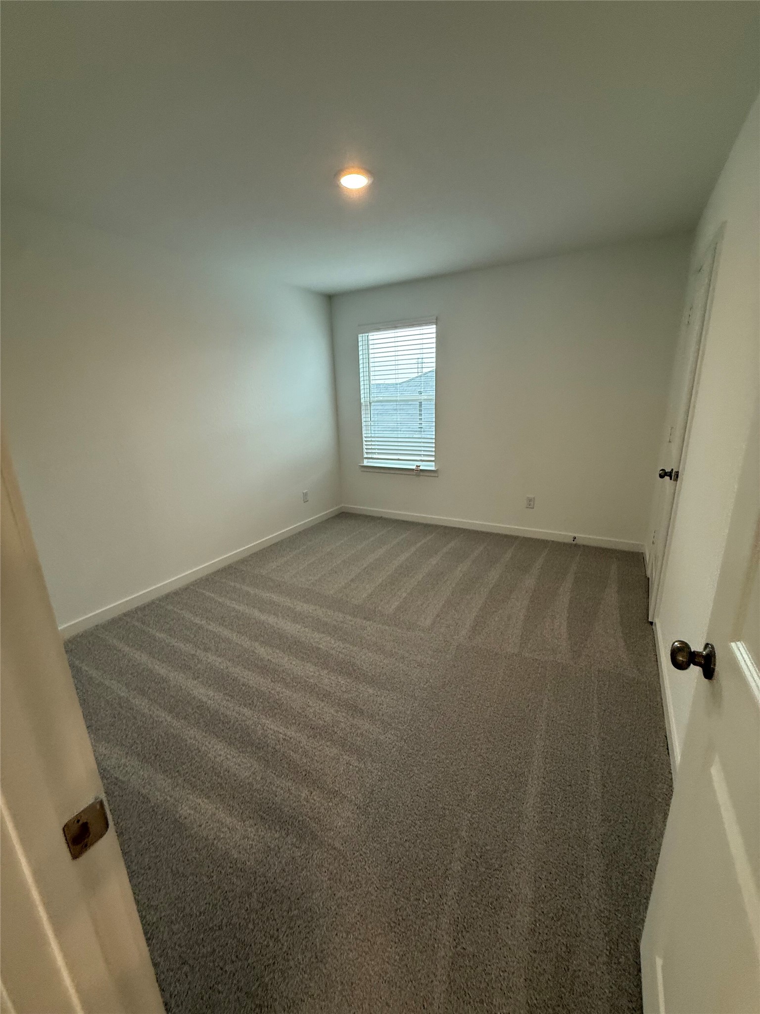 138 Golden Bell Way Buda, TX 78610 - Photo 11 of 17 an empty room with a white door