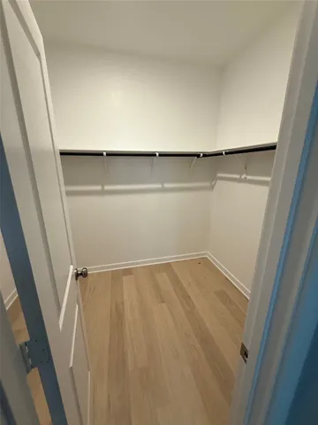 a view of an empty walk in closet