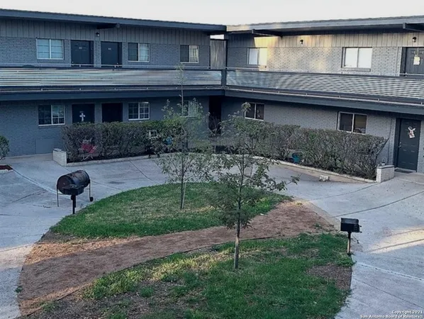 a view of house with a yard